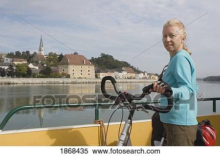 Stock Photography - Female Cyclist, Mauthausen, Austria. Fotosearch