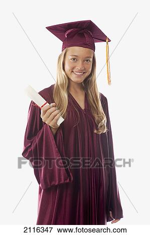 Stock Photo - Female graduate in cap and gown, holding diploma.. Fotosearch