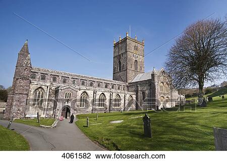 Stock Image - Female priest at St. David's Cathedral; St. David, Pembrokeshire, Wales. Fotosearch