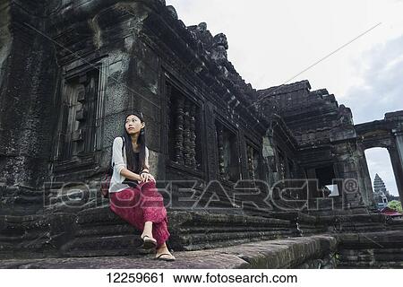 Female tourist at Angkor Wat, City of Temples; Siem Reap, Cambodia View Large Photo Image Stock Image - Female tourist at Angkor Wat, City of Temples; Siem Reap, Cambodia. Fotosearch