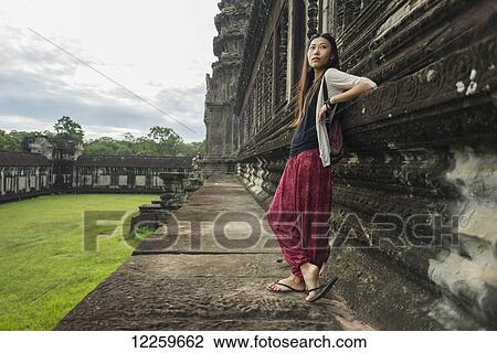 Female tourist at Angkor Wat, City of Temples; Siem Reap, Cambodia View Large Photo Image Stock Image - Female tourist at Angkor Wat, City of Temples; Siem Reap, Cambodia. Fotosearch