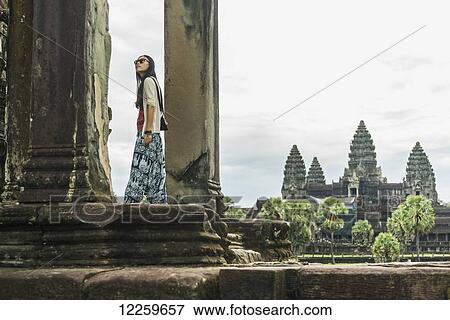 Female tourist at Angkor Wat, City of Temples; Siem Reap, Cambodia View Large Photo Image Stock Photo - Female tourist at Angkor Wat, City of Temples; Siem Reap, Cambodia. Fotosearch