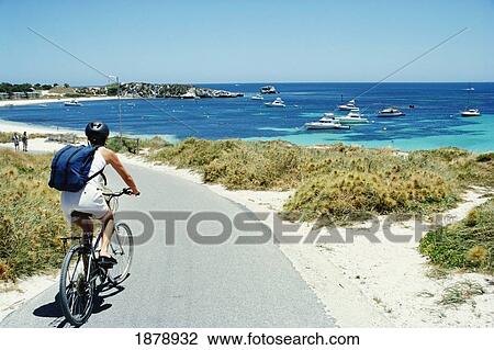 Female Tourist Cycling Along The Beach View Large Photo Image Stock Image - Female Tourist Cycling Along The Beach. Fotosearch