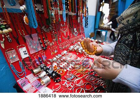 Female Tourist Looking At Jewellery In Souq View Large Photo Image Stock Photo - Female Tourist Looking At Jewellery In Souq. Fotosearch