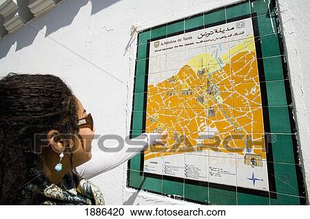 Female Tourist Looking At Medina Map On Wall View Large Photo Image Stock Image - Female Tourist Looking At Medina Map On Wall. Fotosearch