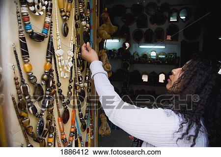 Female Tourist Looking At Some Jewellery In Souk View Large Photo Image Stock Image - Female Tourist Looking At Some Jewellery In Souk. Fotosearch
