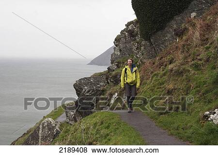 Stock Photo - Female Walker On The South West Coast Path Near Lynmouth, Exmoor, United Kingdom. Fotosearch