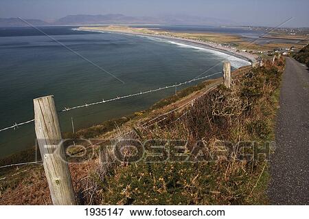 Fence And Road By Beach; Rossbeigh Beach, County Kerry, Ireland View Large Photo Image Stock Photo - Fence And Road By Beach; Rossbeigh Beach, County Kerry, Ireland. Fotosearch