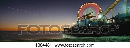 Ferris Wheel And Rollercoaster At Dusk On The Santa Monica Pier View Large Photo Image Stock Image - Ferris Wheel And Rollercoaster At Dusk On The Santa Monica Pier. Fotosearch