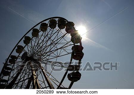 Stock Photo - Ferris Wheel Silhouetted In Sun, Canadian National Exhibition, Toronto, Ontario. Fotosearch
