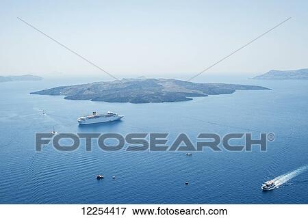 Ferry and boats travel along the coast; Fira, Santorini, Greece View Large Photo Image Stock Photo - Ferry and boats travel along the coast; Fira, Santorini, Greece. Fotosearch
