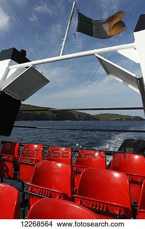 Picture - Ferry leaving Cape Clear island on the Wild Atlantic Way in West Cork; County Cork, Ireland. Fotosearch