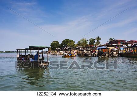 Ferry on the Mekong river from the Island of Don Det to the mainland; Laos View Large Photo Image Picture - Ferry on the Mekong river from the Island of Don Det to the mainland; Laos. Fotosearch