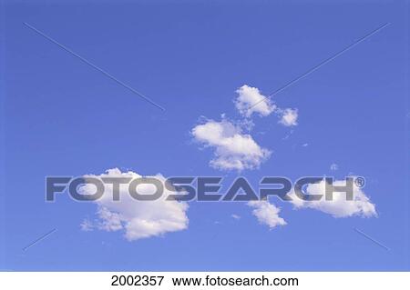 Stock Photo - Few White Clouds In Blue Sky. Fotosearch