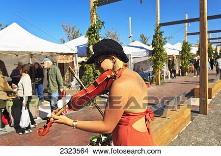Fiddler playing at Saturday crafts market; Santa Fe, New Mexico, USA View Large Photo Image Picture - Fiddler playing at Saturday crafts market; Santa Fe, New Mexico, USA. Fotosearch