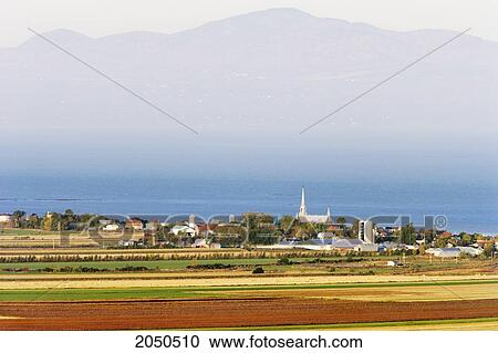 Stock Image - Fields And St. Lawrence River At Sunrise, Kamouraska Village, Bas-Saint-Laurent Region, Quebec. Fotosearch