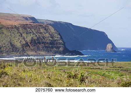 Stock Image - Fifteen Moais From Different Periods, Restored By Archaeologist Claudio Cristino, At Ahu Tongariki, As Seen From Rano Raraku, Rapa Nui (Easter Island), Chile. Fotosearch