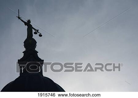 Stock Photograph - Figure Of Justice On Roof Of Central Criminal Court. Fotosearch