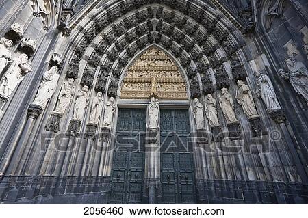 Stock Image - Figures Carved In Stone At The Main Entrance To The Cologne Cathedral, Cologne, North Rhine-Westphalia, Germany. Fotosearch