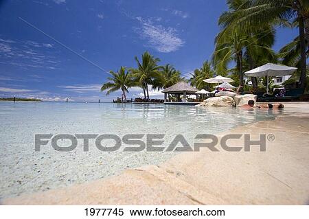 Fiji, A Couple Stay Cool At The Westin Denarau Island Resort And Spa. View Large Photo Image Stock Photography - Fiji, A Couple Stay Cool At The Westin Denarau Island Resort And Spa.. Fotosearch