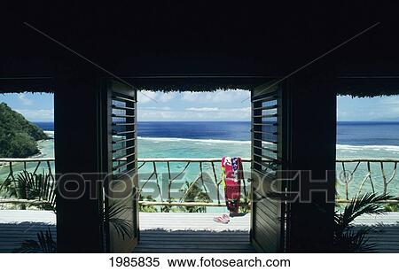 Stock Photography - Fiji, Beautiful ocean view framed by triple doorway; Wakaya Island, Private Home. Fotosearch