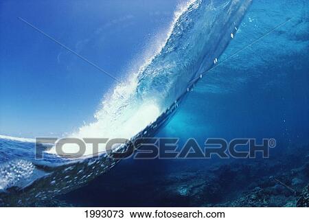 Stock Image - Fiji, Big Wave Half Of Wave Is Submerged, Other Half Is On Surface.. Fotosearch