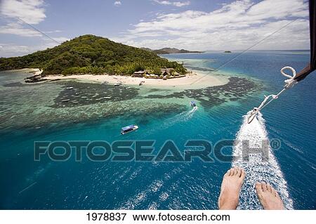 Fiji, Castaway Island, Aerial view of reef and island with human feet in foreground; Mamanucas View Large Photo Image Stock Photo - Fiji, Castaway Island, Aerial view of reef and island with human feet in foreground; Mamanucas. Fotosearch