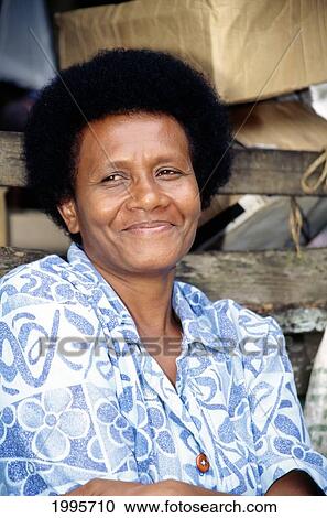 Stock Image - Fiji, Closeup Of Local Woman Smiling, Eyes Looking Away. Fotosearch