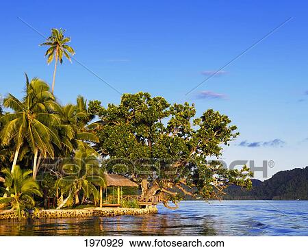 Fiji, Deck And Hanging Chaise Lounge On Coast At Matangi Private Island Resort. For Editorial Use Only. View Large Photo Image Stock Photo - Fiji, Deck And Hanging Chaise Lounge On Coast At Matangi Private Island Resort. For Editorial Use Only.. Fotosearch