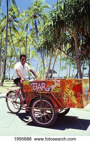 Fiji, Fijian Island Resort, Smiling Local Man Rides Beach Bar Cart View Large Photo Image Stock Photo - Fiji, Fijian Island Resort, Smiling Local Man Rides Beach Bar Cart. Fotosearch