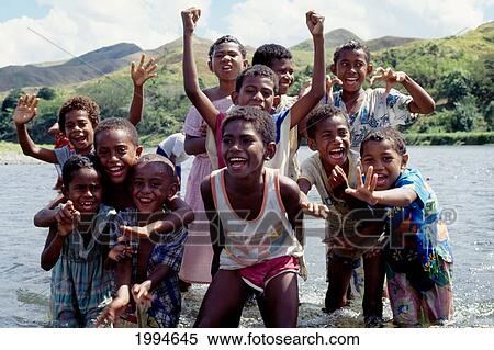 Fiji, Group Of Children In River Smiling For Camera View Large Photo Image Stock Photography - Fiji, Group Of Children In River Smiling For Camera. Fotosearch
