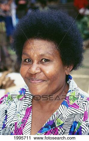 Fiji, Headshot Of Smiling Fijian Woman Outdoors, Wearing Colorful Printed Blouse View Large Photo Image Stock Image - Fiji, Headshot Of Smiling Fijian Woman Outdoors, Wearing Colorful Printed Blouse. Fotosearch