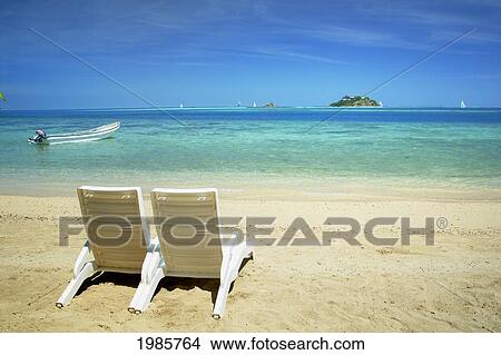 Fiji Mamanuca Islands Beach With Two Chairs Facing Out Fiji Mamanuca Islands Beach With Two