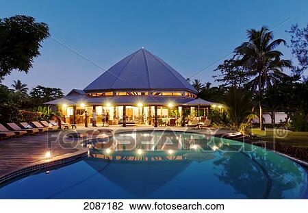 Stock Image - Fiji, Matangi Private Island Resort, Dining room pavilion and swimming pool.. Fotosearch