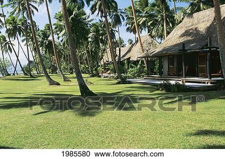 Stock Image - Fiji, Oceanfront villas in Cousteau Fiji Island Resort; Savusavu. Fotosearch