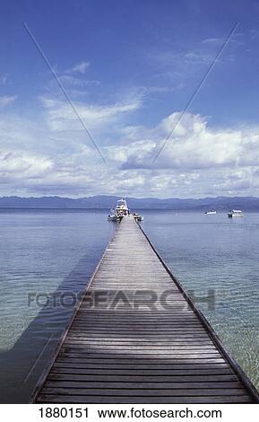 Stock Image - Fiji, Pier Leading Into The Distance; Vanua Levu. Fotosearch