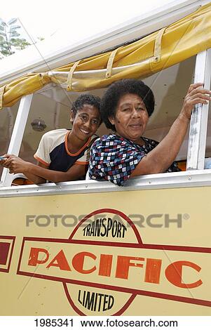 Stock Image - Fiji, Taveuni, Fijian Woman And Young Boy On A Public Bus. For Editorial Use Only.. Fotosearch