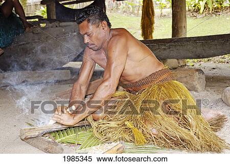 Fiji, Viti Levu, Coral Coast, Pacific Harbor, Arts Village, Fijian Man In Trditional Outfit Making Fire With Wooden Sticks. No Model Release View Large Photo Image Stock Photography - Fiji, Viti Levu, Coral Coast, Pacific Harbor, Arts Village, Fijian Man In Trditional Outfit Making Fire With Wooden Sticks. No Model Release. Fotosearch