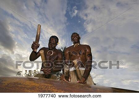 Fiji, Viti Levu, Fijian Natives Drumming At A Village Ceremony. View Large Photo Image Stock Image - Fiji, Viti Levu, Fijian Natives Drumming At A Village Ceremony.. Fotosearch