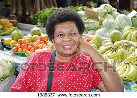Stock Photo - Fiji, Viti Levu, Sigatoka, Fijian Woman Selling Produce At A Market. For Editorial Use Only.. Fotosearch