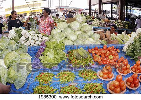 Stock Image - Fiji, Viti Levu, Sigatoka, Fijian Women Selling Produce At A Market. For Editorial Use Only.. Fotosearch