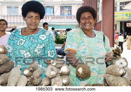 Fiji, Viti Levu, Sigatoka, Fijian Women Selling Casava Root At A Local Market. For Editorial Use Only. View Large Photo Image Stock Image - Fiji, Viti Levu, Sigatoka, Fijian Women Selling Casava Root At A Local Market. For Editorial Use Only.. Fotosearch
