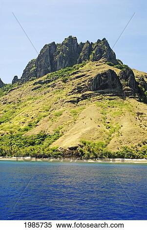 Stock Photography - Fiji, Yasawas, Waya Island, Dramatic Rock Formation, View From Ocean.. Fotosearch
