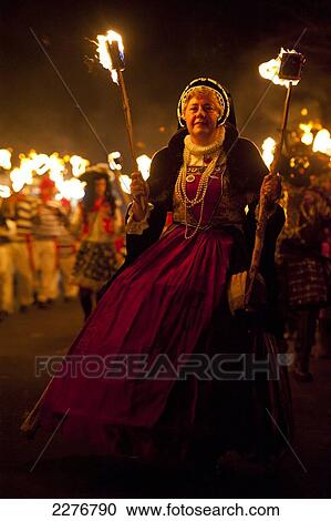 Finely dressed woman walking in procession at East Hoathly Bonfire Night; East Sussex, England View Large Photo Image Stock Image - Finely dressed woman walking in procession at East Hoathly Bonfire Night; East Sussex, England. Fotosearch