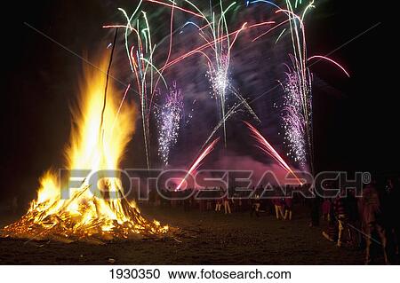 Fireworks and a bonfire on Guy Fawkes Day; Battle, East Sussex, England View Large Photo Image Stock Image - Fireworks and a bonfire on Guy Fawkes Day; Battle, East Sussex, England. Fotosearch