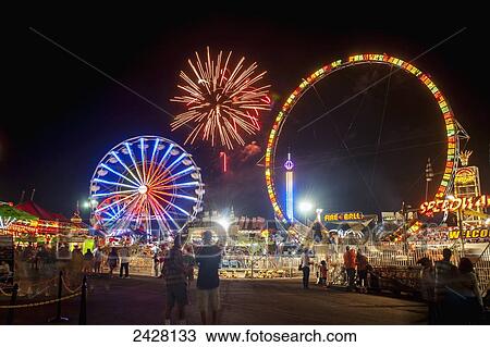 Fireworks and ferris wheels at night at the Maryland State Fair; Timonium, Maryland, United States of America View Large Photo Image Stock Image - Fireworks and ferris wheels at night at the Maryland State Fair; Timonium, Maryland, United States of America. Fotosearch
