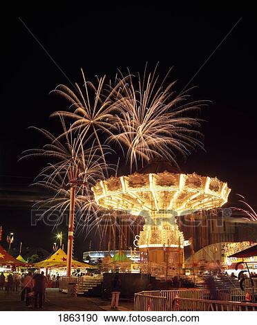 Fireworks And Midway Rides; Calgary, Alberta, Canada View Large Photo Image Stock Image - Fireworks And Midway Rides; Calgary, Alberta, Canada. Fotosearch