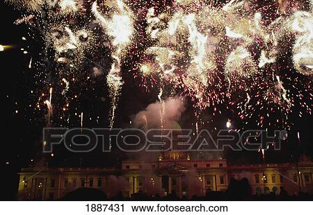 Stock Image - Fireworks Over Custom House On St Patrick's Day. Fotosearch