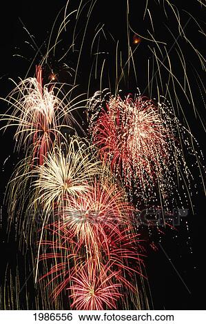 Stock Photograph - Fireworks, Red And White Shower Against Black Background.. Fotosearch
