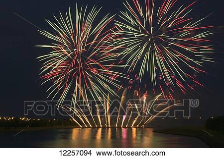 Fireworks reflecting on a lake; Calgary, Alberta, Canada View Large Photo Image Picture - Fireworks reflecting on a lake; Calgary, Alberta, Canada. Fotosearch